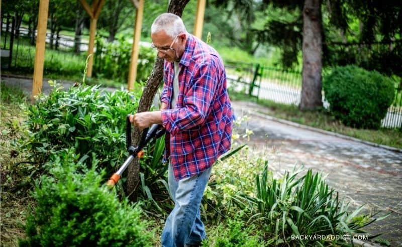 senior using string trimmer
