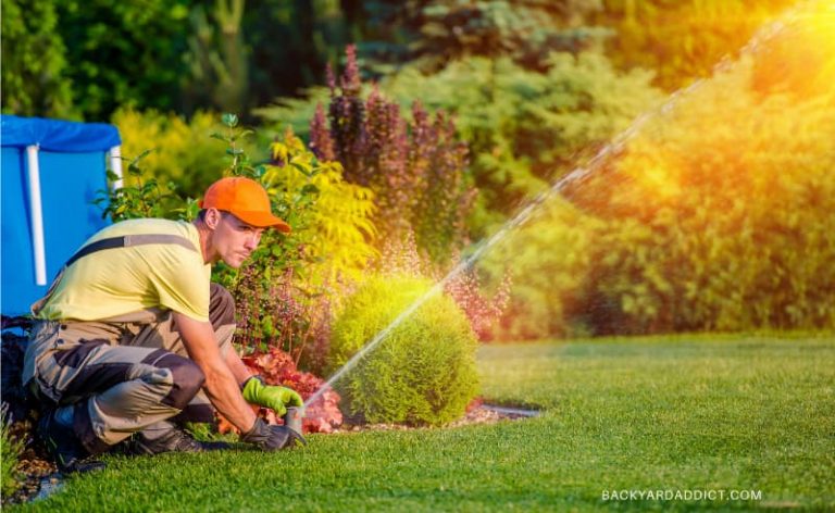gardener adjust a sprinkler head