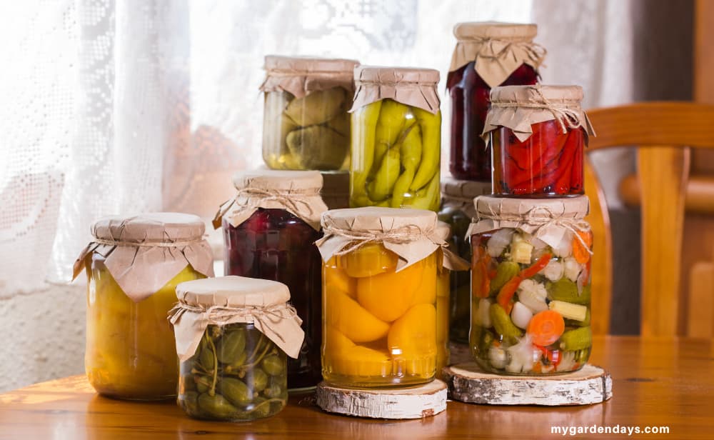 A selection of home canned fruits and vegetables displayed on a table