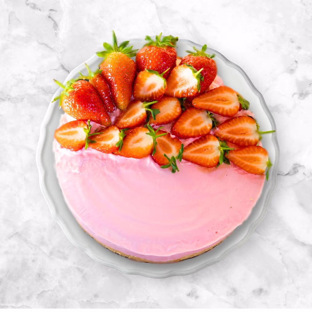 finished no bake strawberry cheesecake on a plate