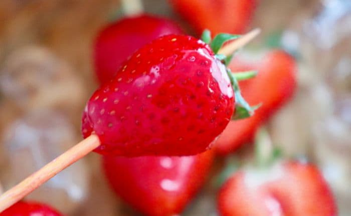 one candied Strawberry tanghulu with sugar coating