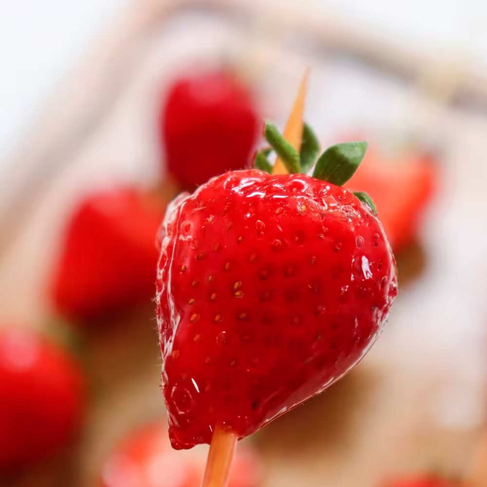 one candied Strawberry tanghulu with sugar coating