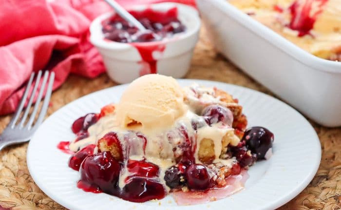 a serving of cherry dump cake with ice cream