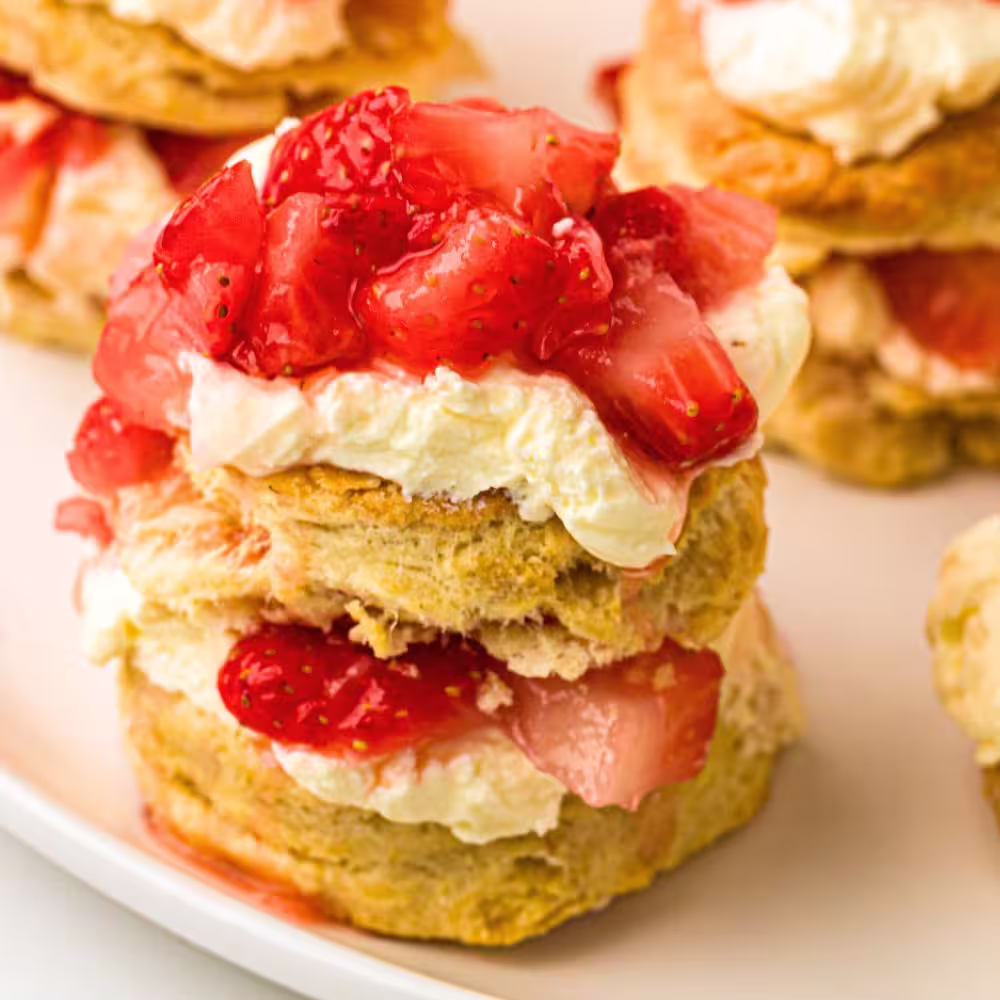 An assembled strawberry shortcake ready to be eaten